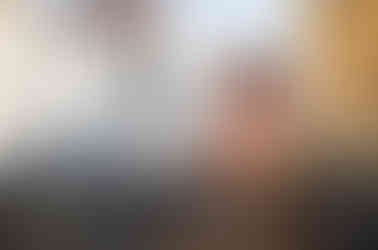 woman sitting having coffee in front of a church in florence italy