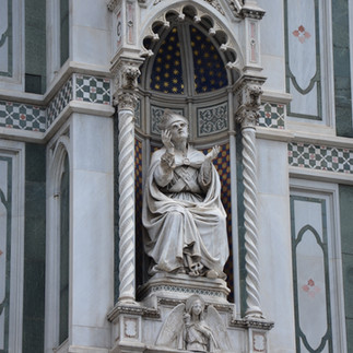 statue on a cathedral in florence, italy